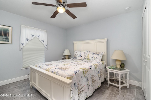 bedroom featuring hardwood / wood-style floors and ceiling fan