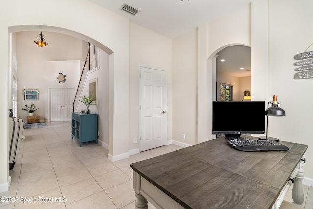 home office featuring light tile patterned flooring