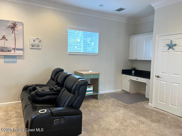 office featuring light colored carpet and crown molding