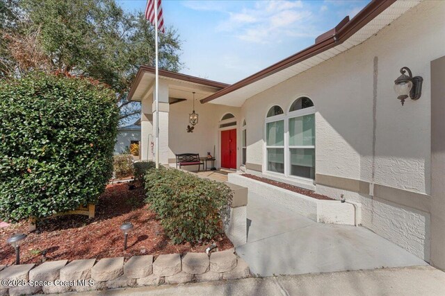 doorway to property featuring a patio area