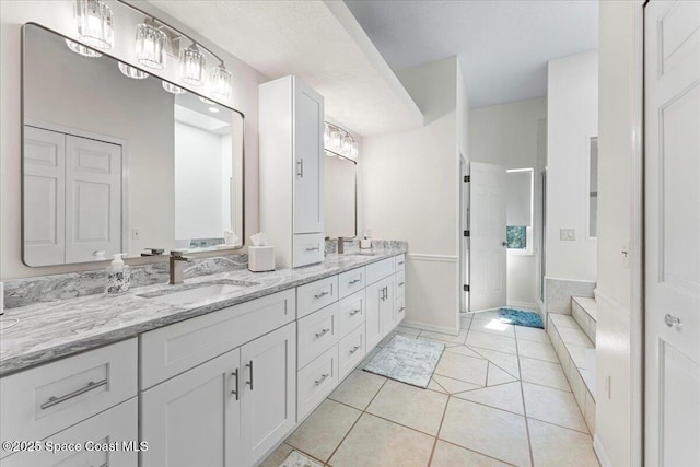 bathroom featuring tile patterned floors and vanity