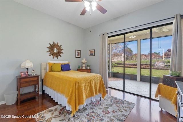 bedroom with dark hardwood / wood-style flooring, access to outside, and ceiling fan