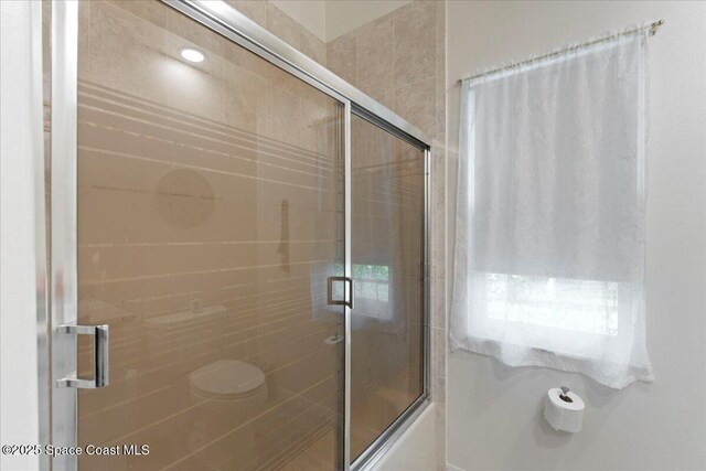 bathroom featuring enclosed tub / shower combo