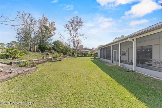 view of yard featuring a sunroom