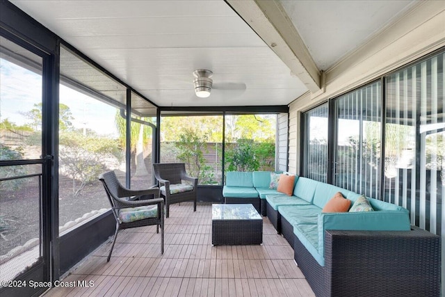 sunroom / solarium with beam ceiling and plenty of natural light