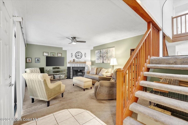 carpeted living room featuring ceiling fan, crown molding, and a textured ceiling