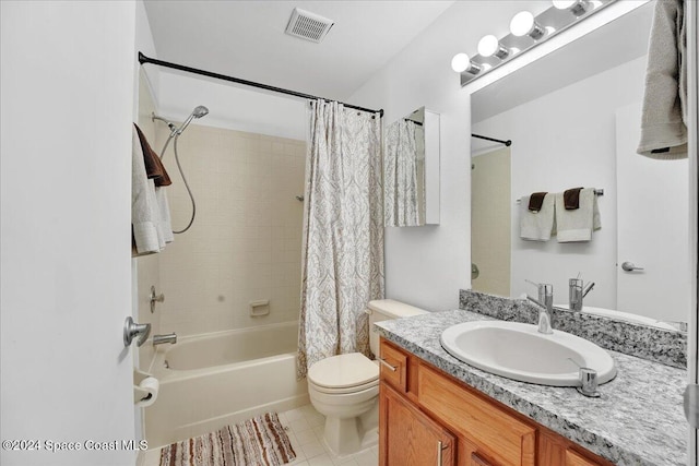 full bathroom with tile patterned floors, vanity, toilet, and shower / bath combo with shower curtain