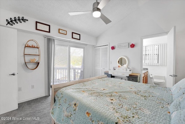 bedroom featuring ceiling fan, carpet floors, a textured ceiling, lofted ceiling, and a closet