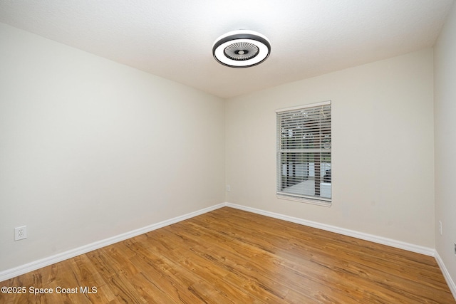 empty room featuring hardwood / wood-style floors