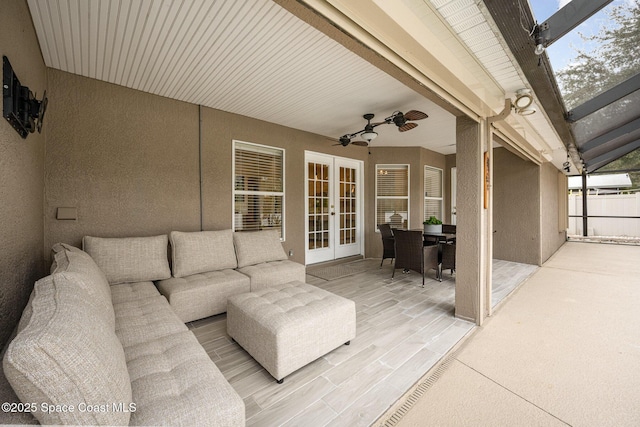 view of patio / terrace featuring ceiling fan, french doors, and an outdoor living space