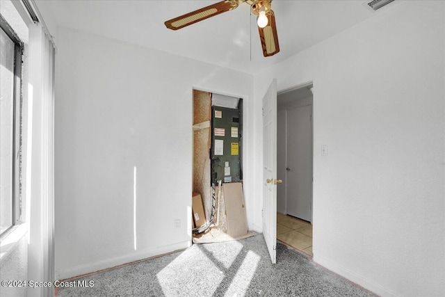 unfurnished bedroom featuring heating unit and ceiling fan