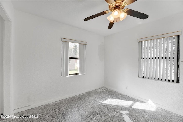 unfurnished room featuring ceiling fan