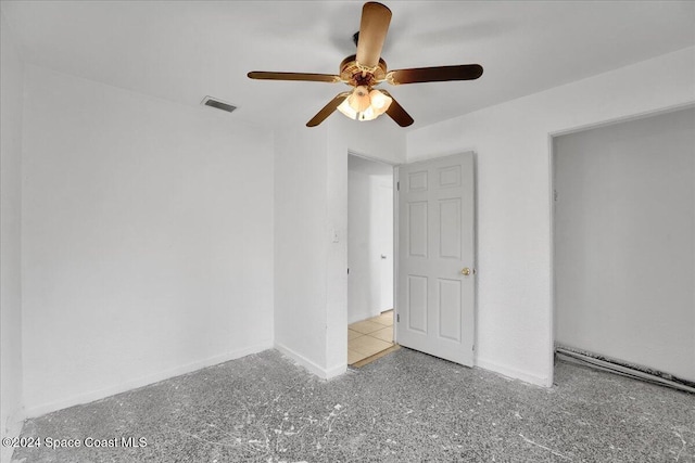 unfurnished room with ceiling fan