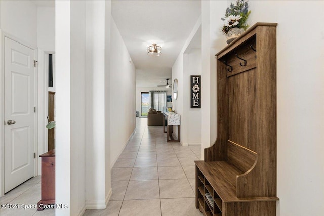 hallway with light tile patterned floors