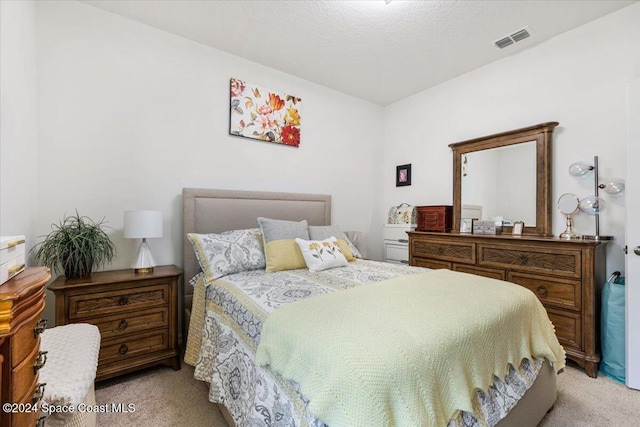 bedroom with light carpet