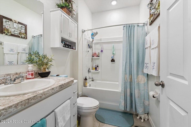 full bathroom featuring tile patterned floors, toilet, vanity, and shower / tub combo