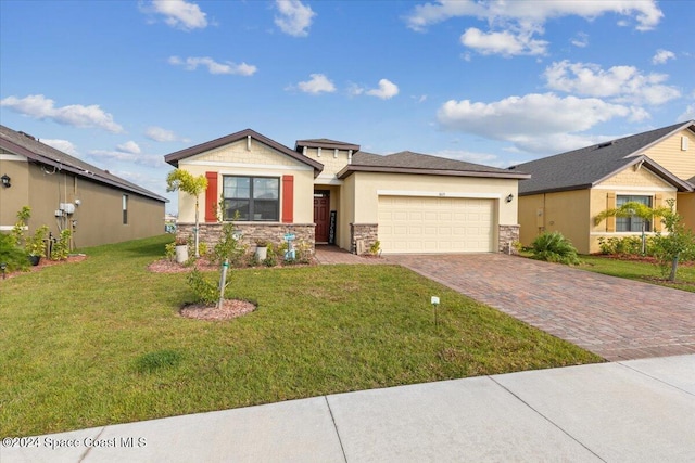 view of front of property with a garage and a front lawn