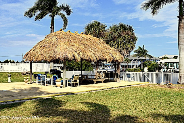 exterior space featuring a lawn and a gazebo