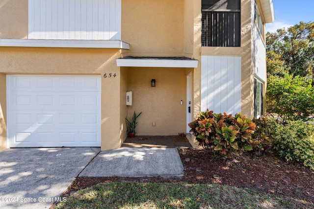 entrance to property featuring a garage