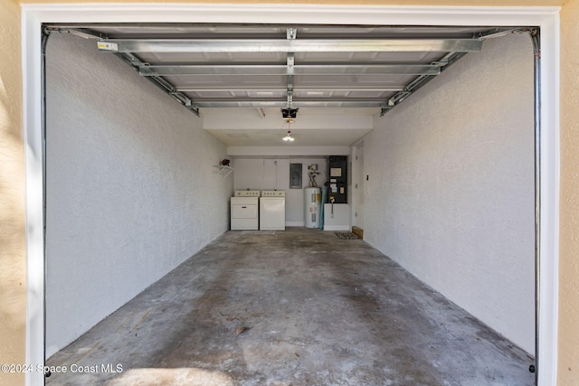 garage with independent washer and dryer, electric panel, and water heater