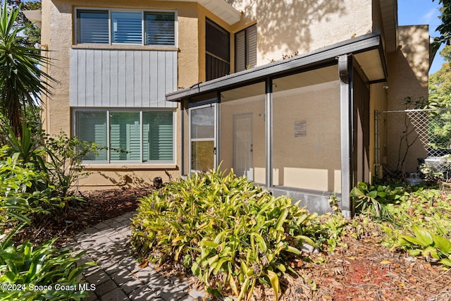 back of property featuring a sunroom