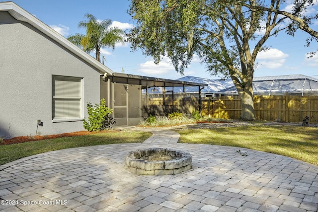 view of patio / terrace with an outdoor fire pit