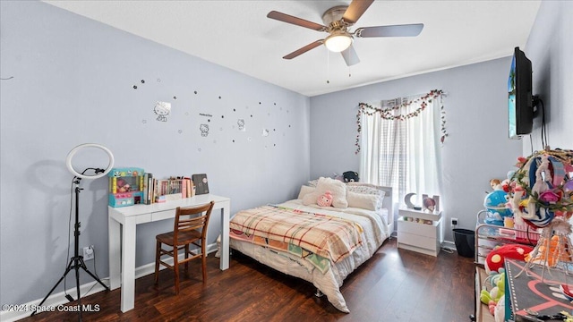 bedroom featuring dark hardwood / wood-style floors and ceiling fan