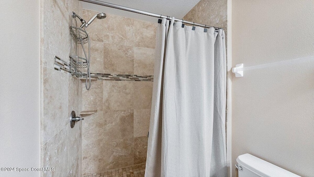 bathroom with toilet and curtained shower