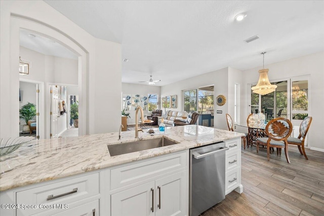 kitchen featuring white cabinetry, ceiling fan, sink, and stainless steel dishwasher