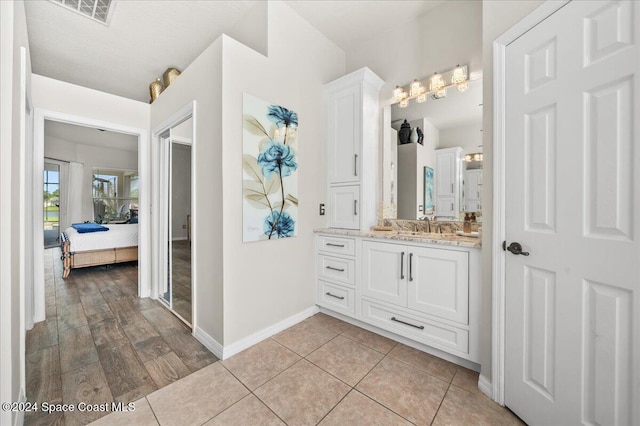 bathroom with hardwood / wood-style floors and vanity