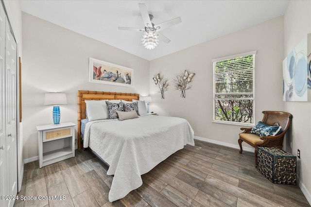 bedroom featuring a closet, hardwood / wood-style floors, and ceiling fan