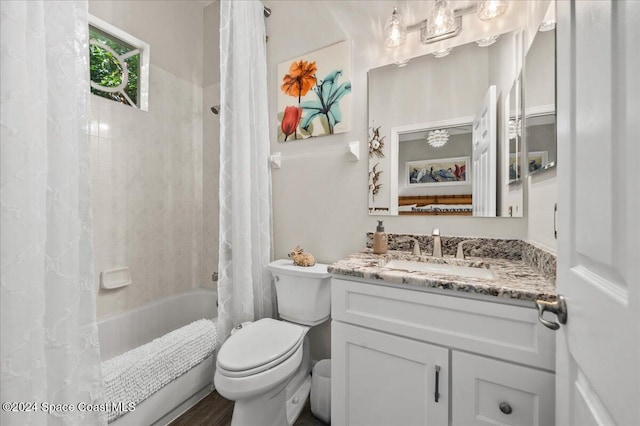 full bathroom featuring wood-type flooring, vanity, toilet, and shower / bath combo with shower curtain