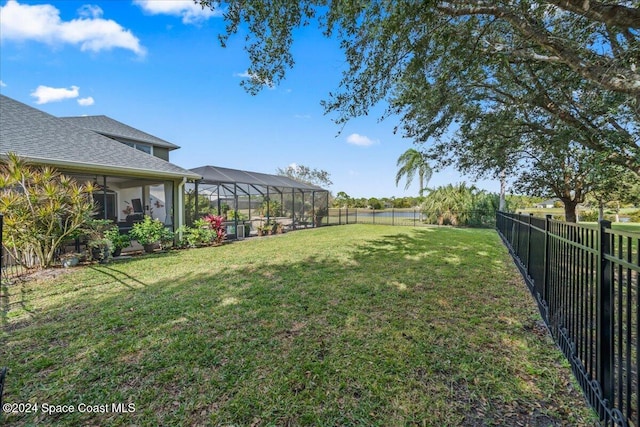 view of yard featuring a lanai