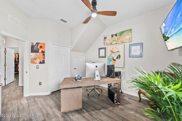 home office with hardwood / wood-style floors, ceiling fan, and vaulted ceiling