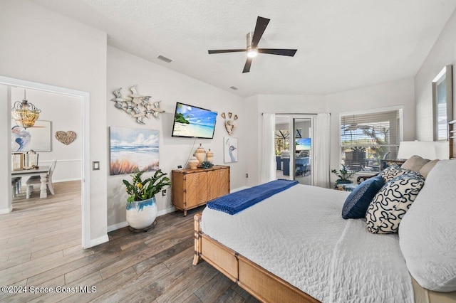 bedroom featuring hardwood / wood-style floors, ceiling fan, and access to outside