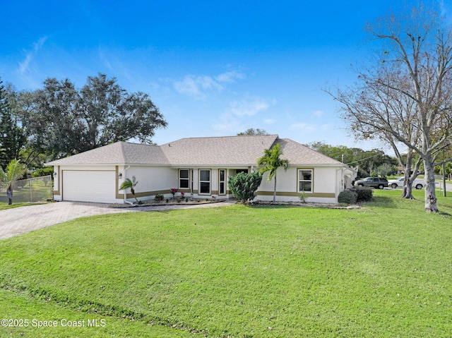 ranch-style house with a garage and a front lawn