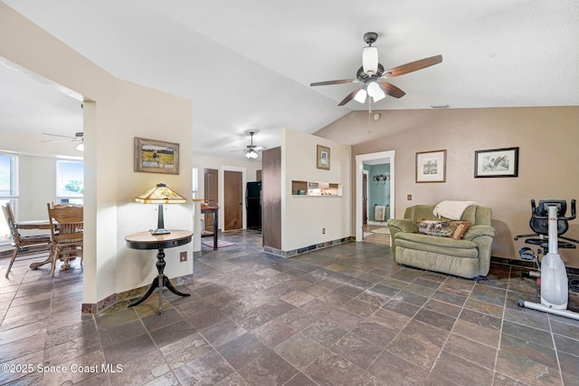 living room featuring lofted ceiling