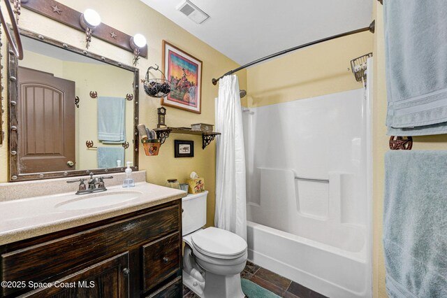 full bathroom featuring shower / bath combo, vanity, and toilet