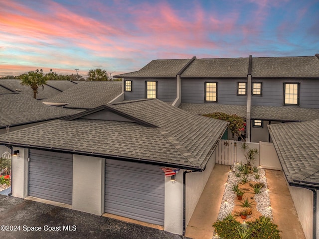 view of front of property with a garage