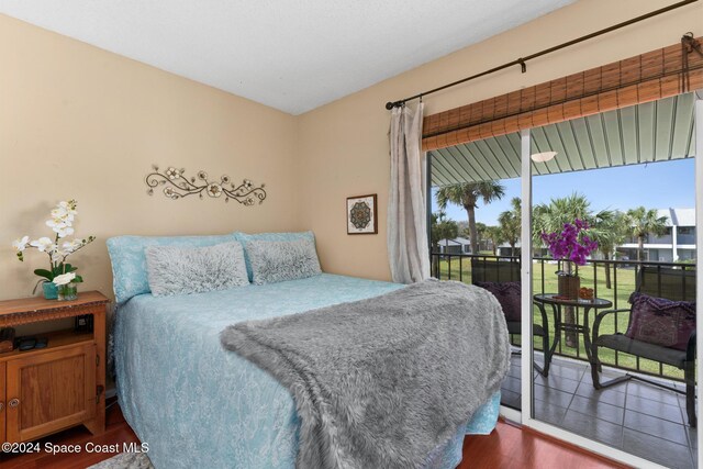 737 Palm Springs Cir, Indian Harbour Beach, FL 32937 - bedroom featuring access to outside, multiple windows, and wood finished floors