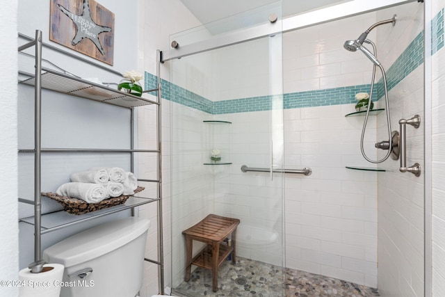 737 Palm Springs Cir, Indian Harbour Beach, FL 32937 - bathroom featuring tiled shower and toilet