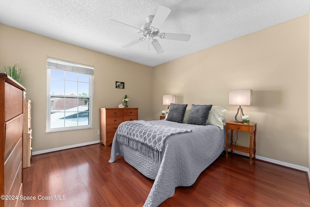 737 Palm Springs Cir, Indian Harbour Beach, FL 32937 - bedroom with wood finished floors, a textured ceiling, and ceiling fan
