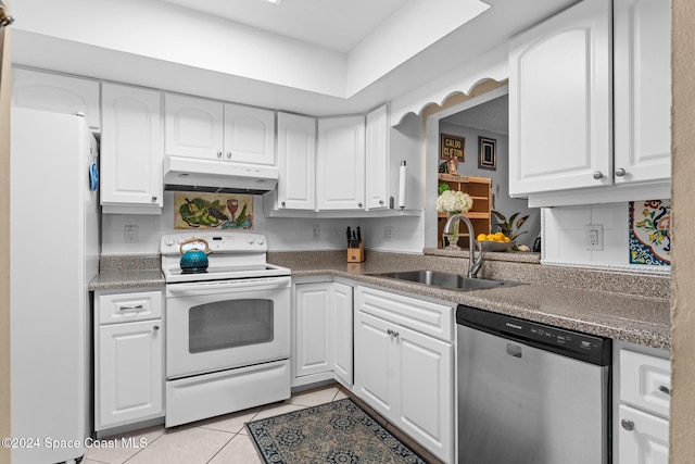 737 Palm Springs Cir, Indian Harbour Beach, FL 32937 - kitchen featuring white appliances, under cabinet range hood, light tile patterned floors, and white cabinets