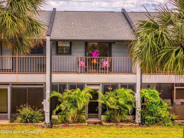 737 Palm Springs Cir, Indian Harbour Beach, FL 32937 - rear view of property featuring roof with shingles and a balcony