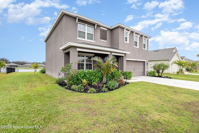 view of front facade with a garage and a front lawn