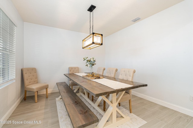 dining area with light hardwood / wood-style floors