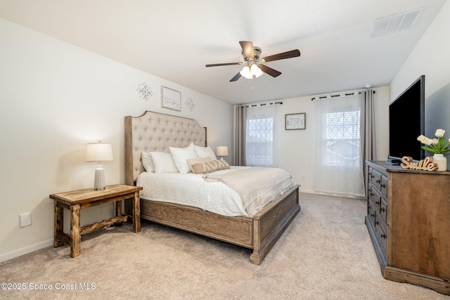 bedroom featuring light carpet and ceiling fan