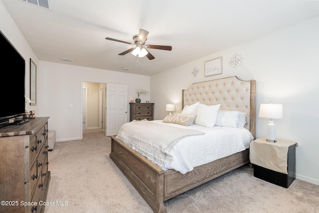 bedroom featuring light carpet and ceiling fan