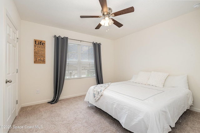 carpeted bedroom featuring ceiling fan