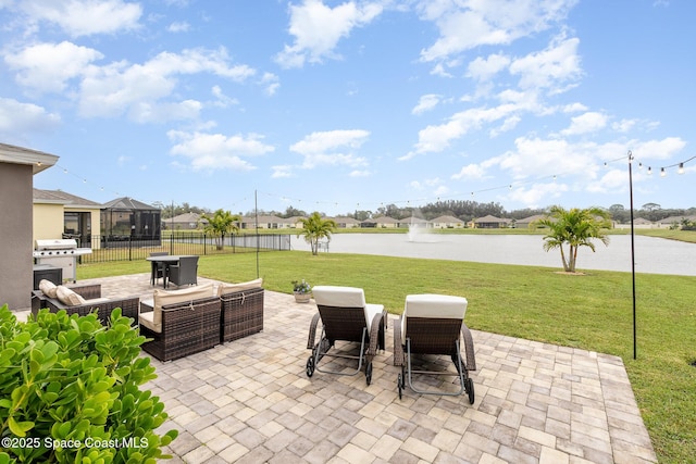 view of patio / terrace featuring a water view and a grill